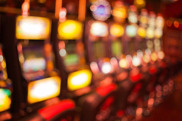 Live dealer revealing community cards in Casino Hold'em